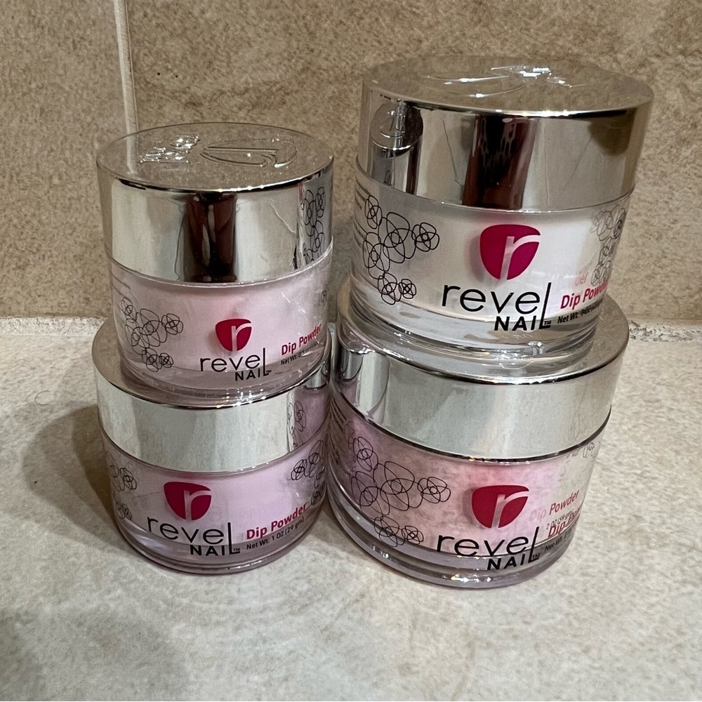 Four jars of revel dip powder